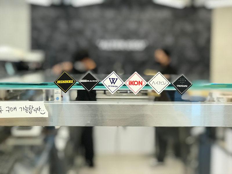 YG the SameE cafe YG artists brand logos stuck on the counter