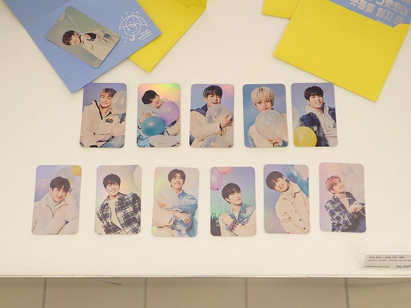 TREASURE photo cards on display at YG the SameE cafe