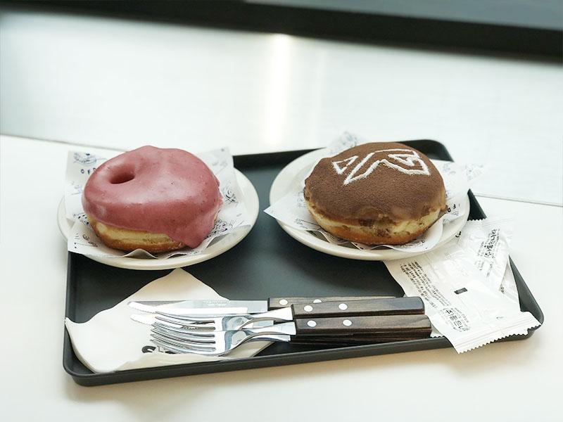raspberry donut and the sameE donut served on a black tray at YG the SameE cafe