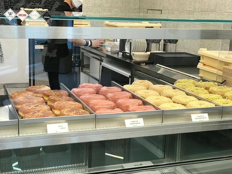 YG the SameE cafe donuts on display behind the counter