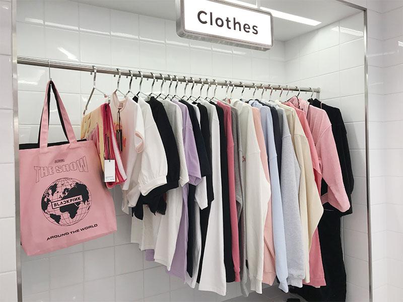 BLACKPINK clothes and bag merchandise on display at YG the SameE cafe