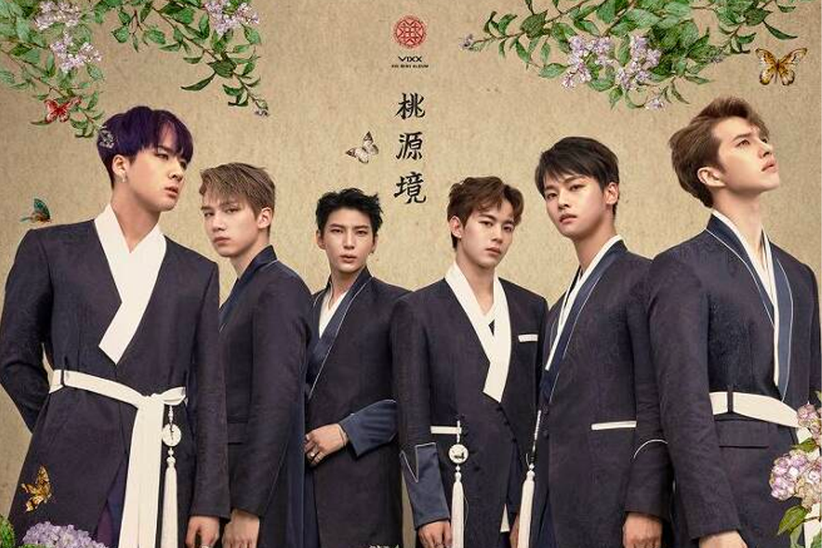 VIXX members in traditional attire with floral and butterfly decorations, reflecting the '希臘神話三部曲' inspired by Greek mythology.