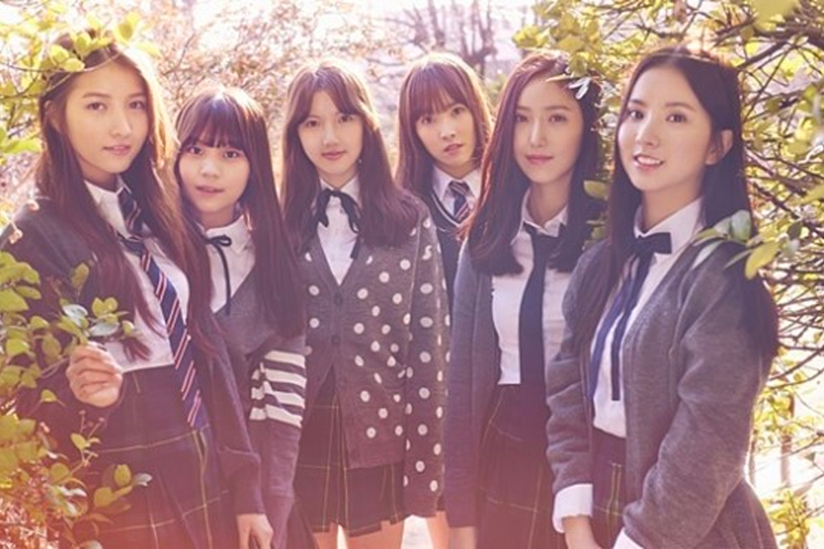 GFRIEND members in school uniforms amidst a nature backdrop, symbolizing their '학교 삼부작' theme.