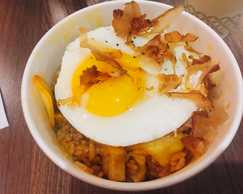 top view of cup rice topped with egg and cheese from korean franchise gggo