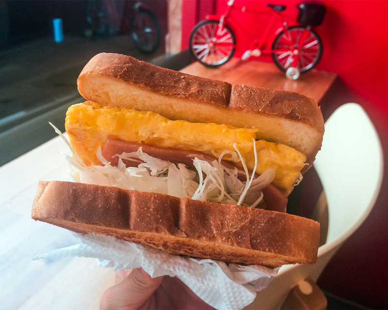 Inside fillings of eggs ham and lettuce toast from korean franchise isaac toast