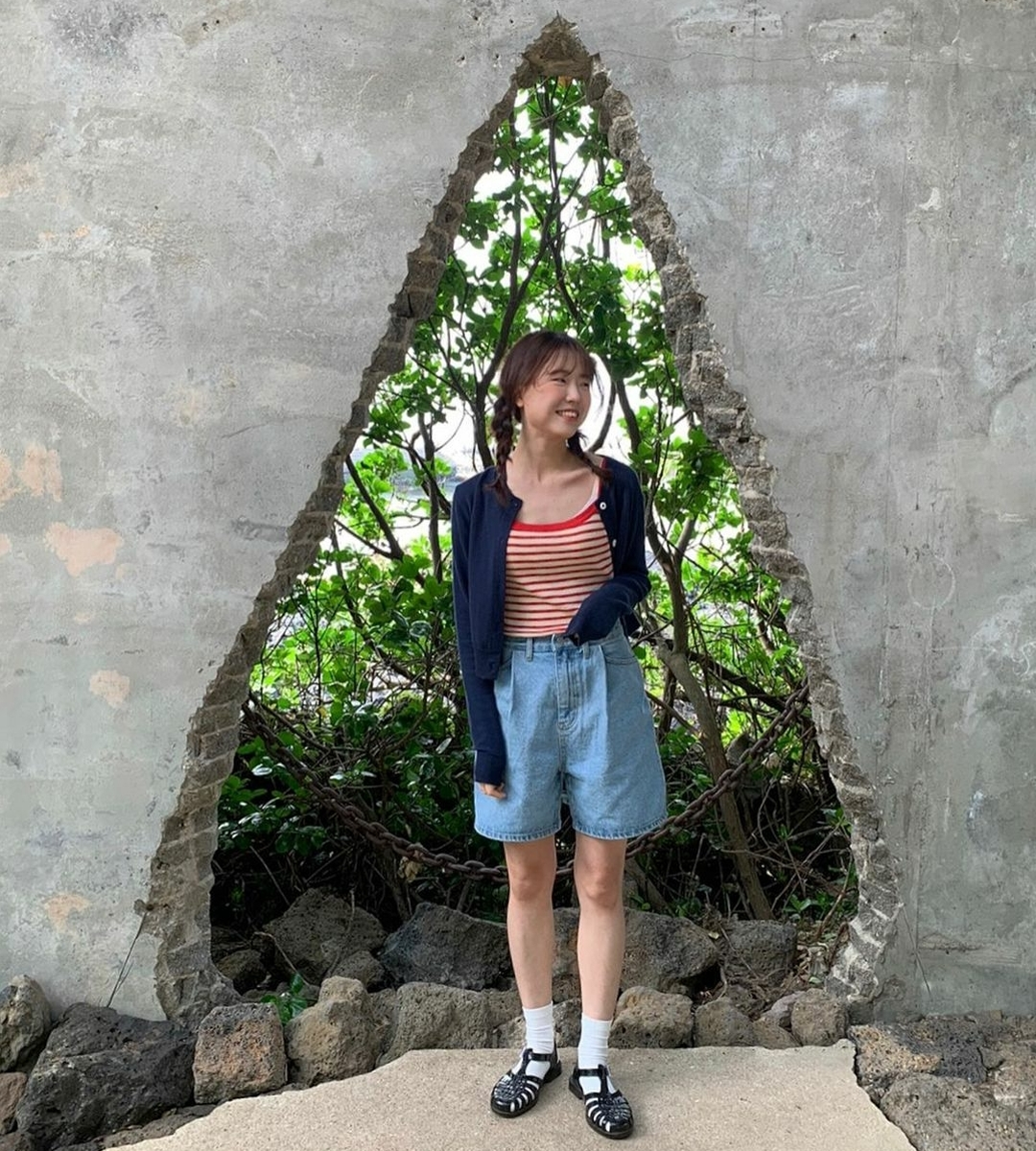 Girl posing outside of Gongbech on Jeju Island 