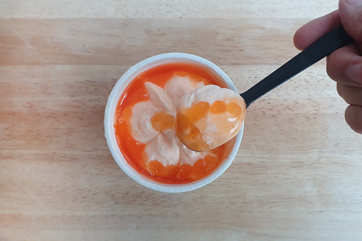 black spoonful of melon syrup and ice cream Red Melon Ice from GS25