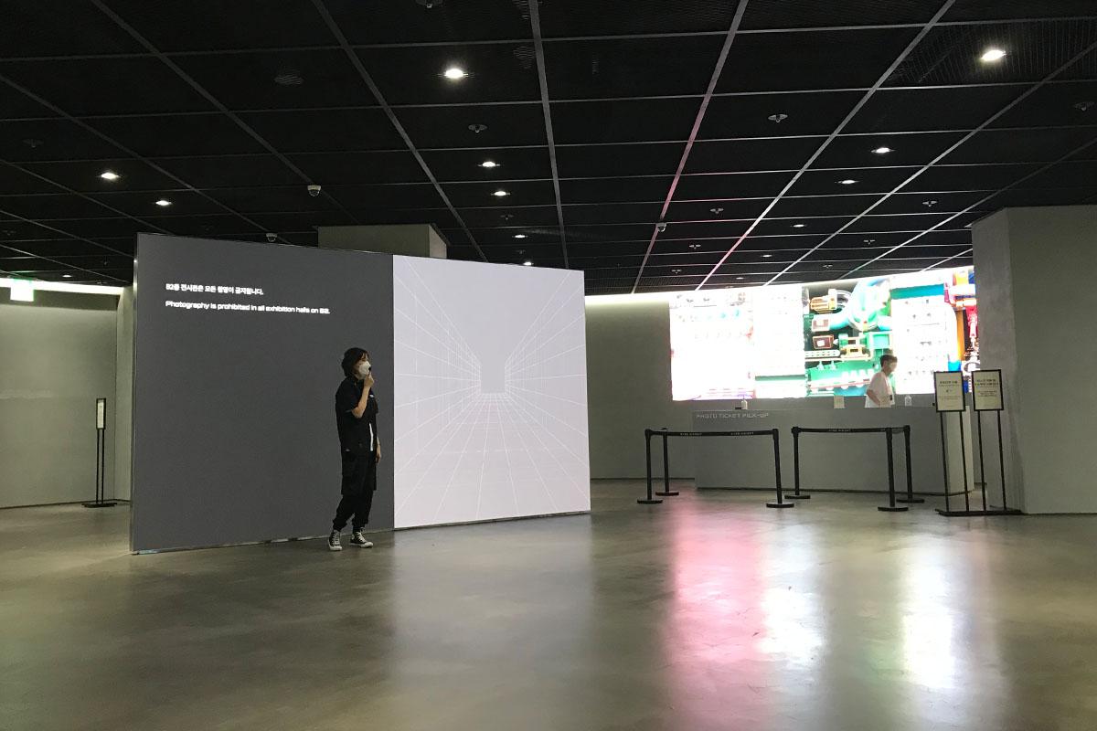 Museum employee greeting visitors