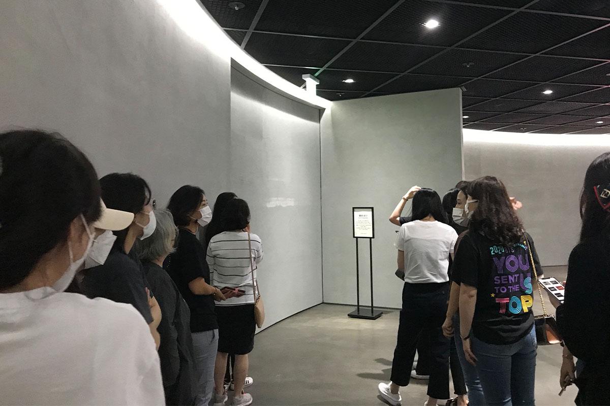 Visitors waiting in line to enter museum