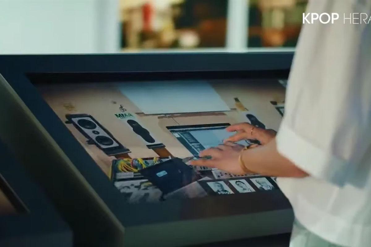 Visitor interacting with screen from exhibition