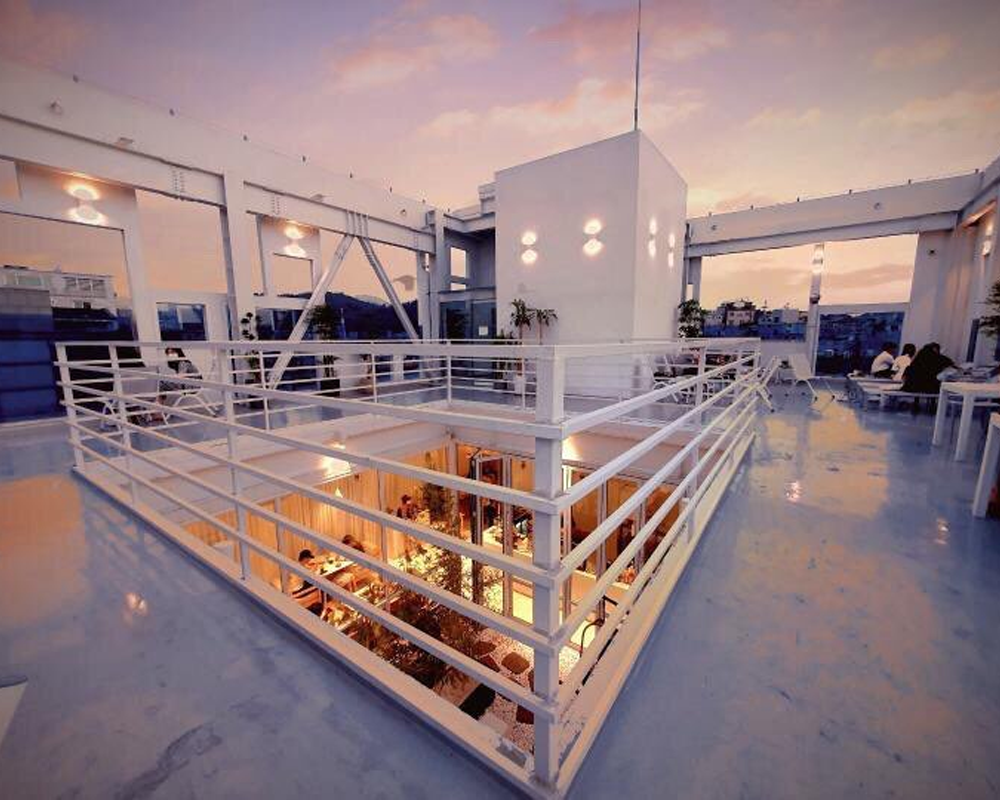 Designery Cafe rooftop white interior design