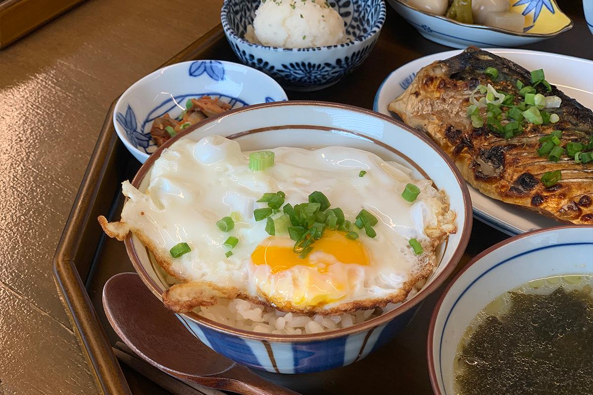 Bowl of rice with fried egg on top