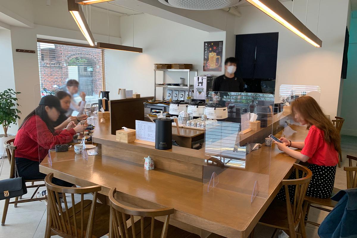 Interior shot of restaurant with customers eating and waiting on their orders