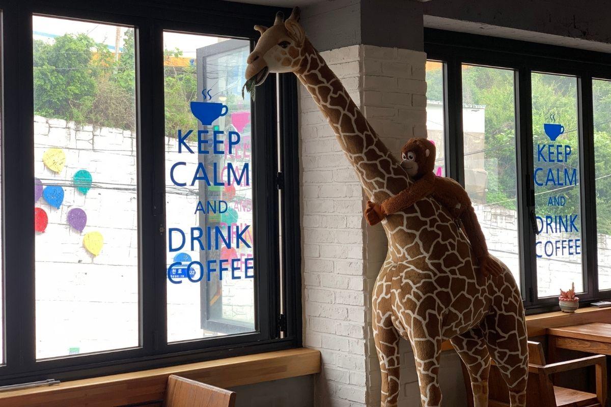 Giant stuffed giraffe at CAFE AVANT GARDE