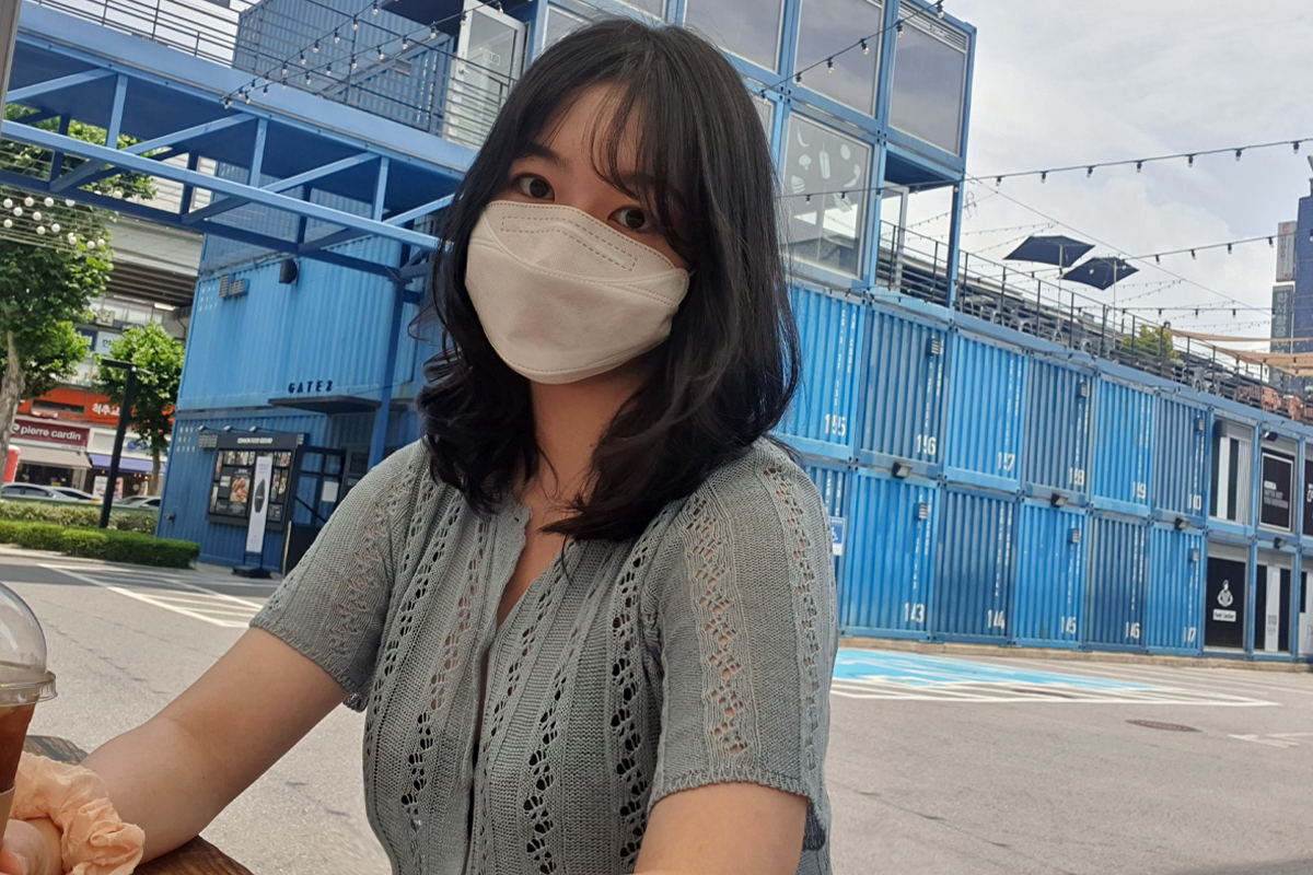 Visitor sitting in shopping area with coffee drink