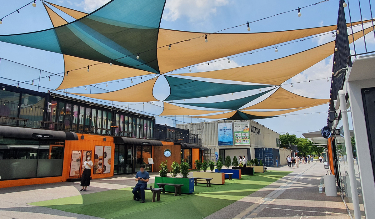 Shot of canopy covers of seating area of shopping center in Seoul