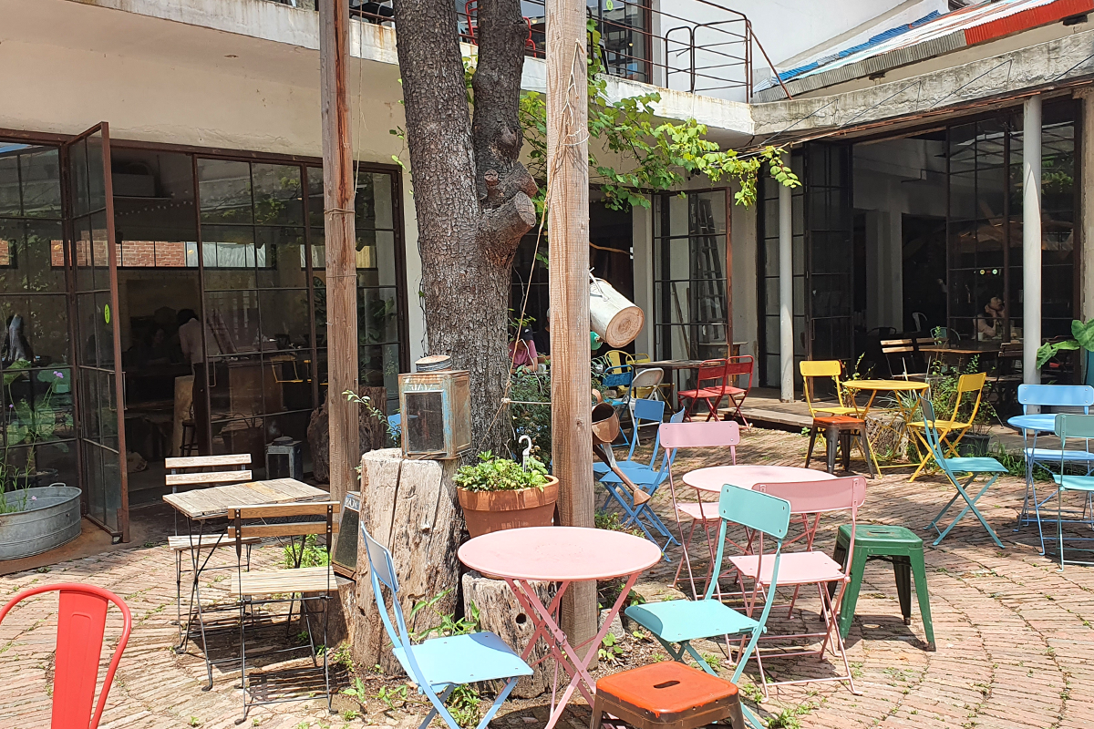 Outdoor seating area featuring colorful chairs and tables