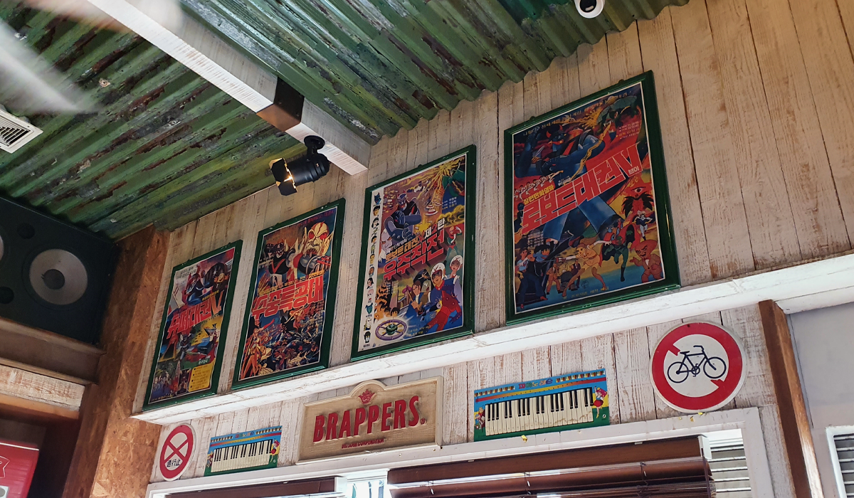 Movie posters and signage in restaurant bar in Seoul