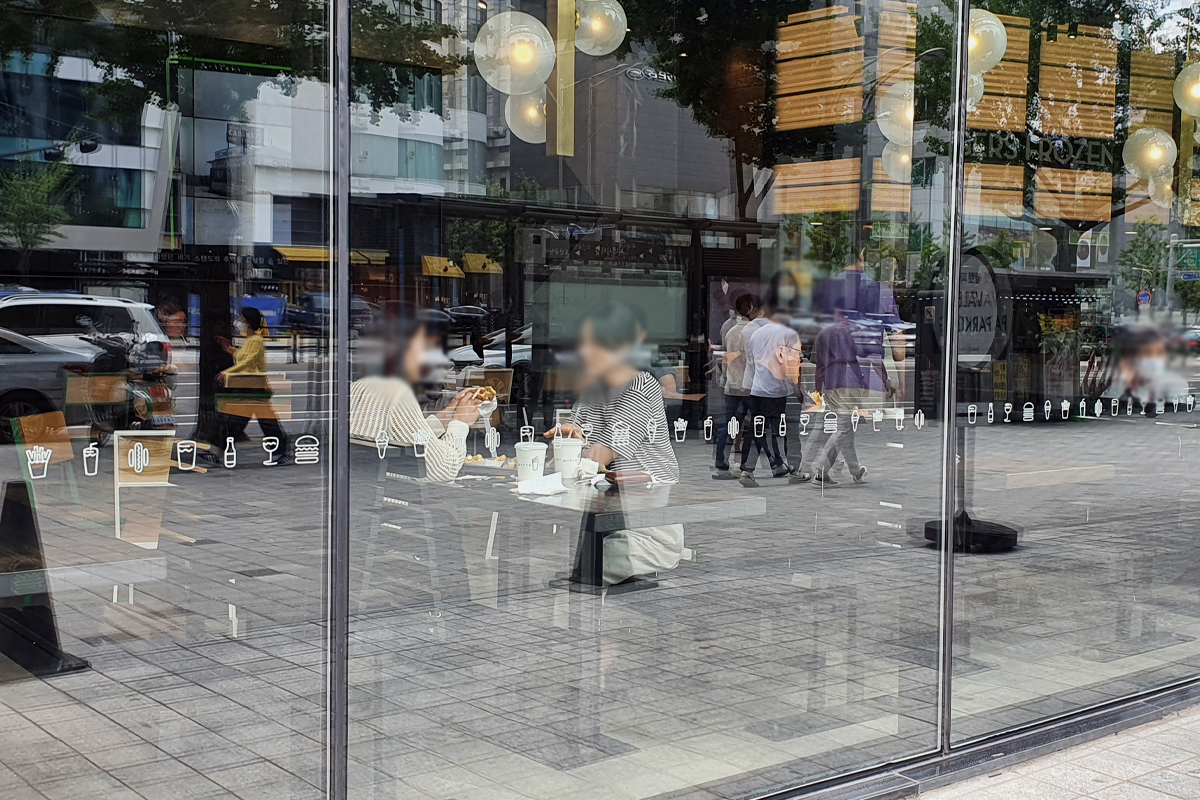 Customers at Shake Shack restaurant eating