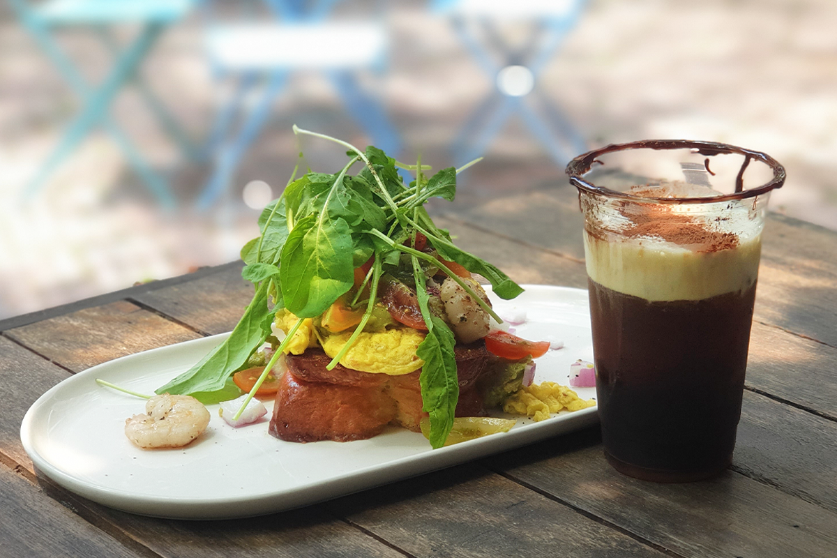 Open-faced sandwich and coffee drink