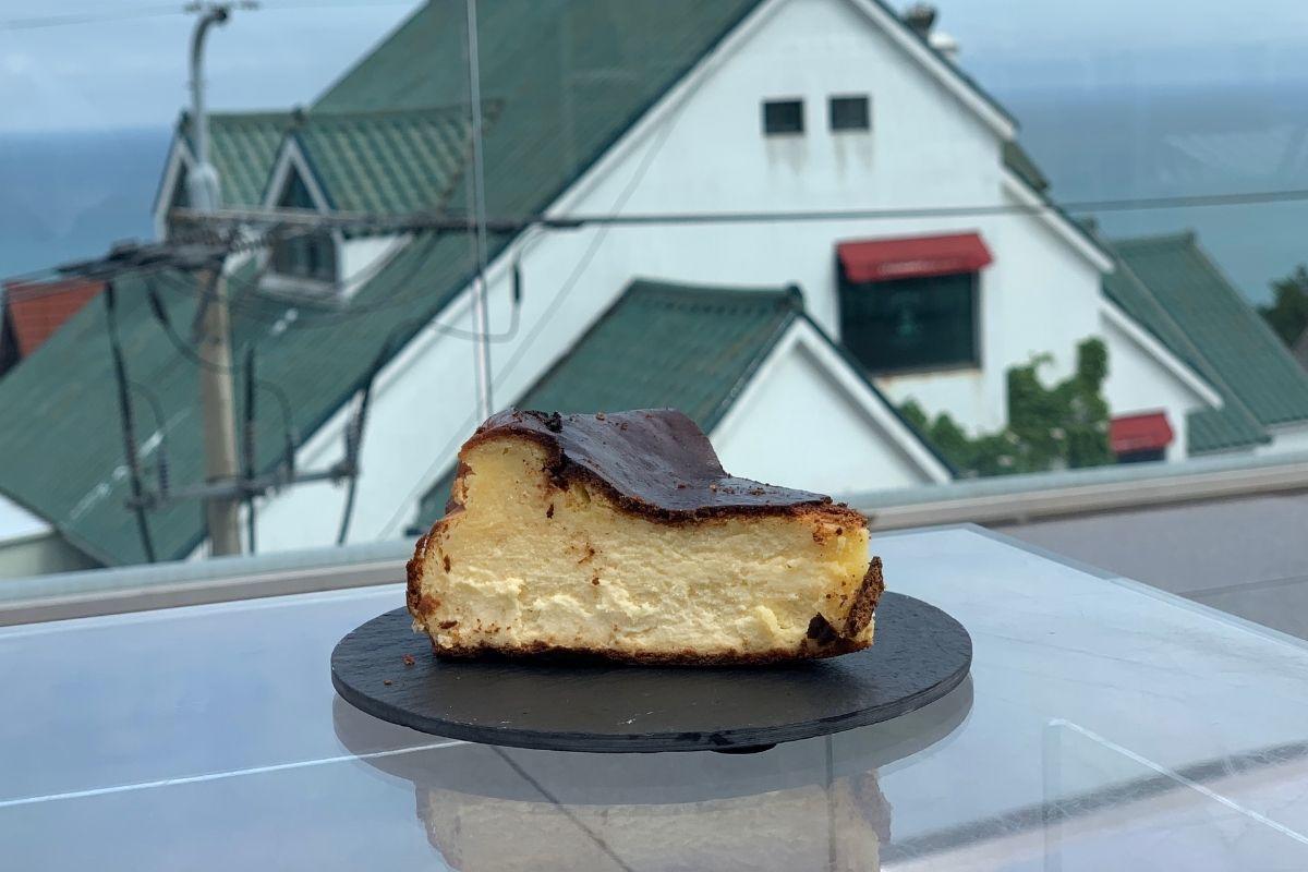 Basque Burnt Cheesecake from Cafe In Busan on a glass table outside