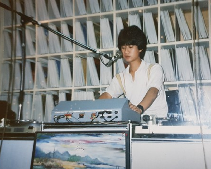 Image of DJ in DJ booth in music cafe in Korea during the 1980s