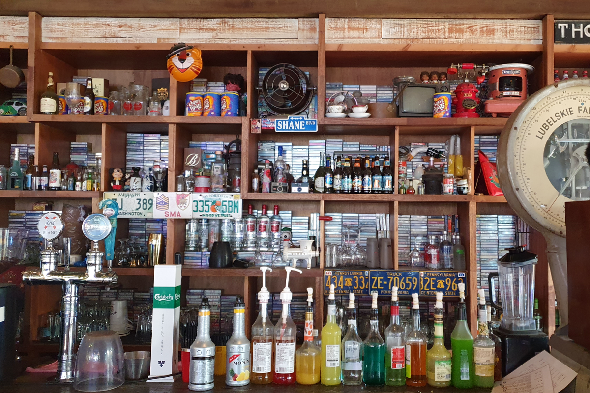 Another display featuring cassette tapes and bottles of alcohol