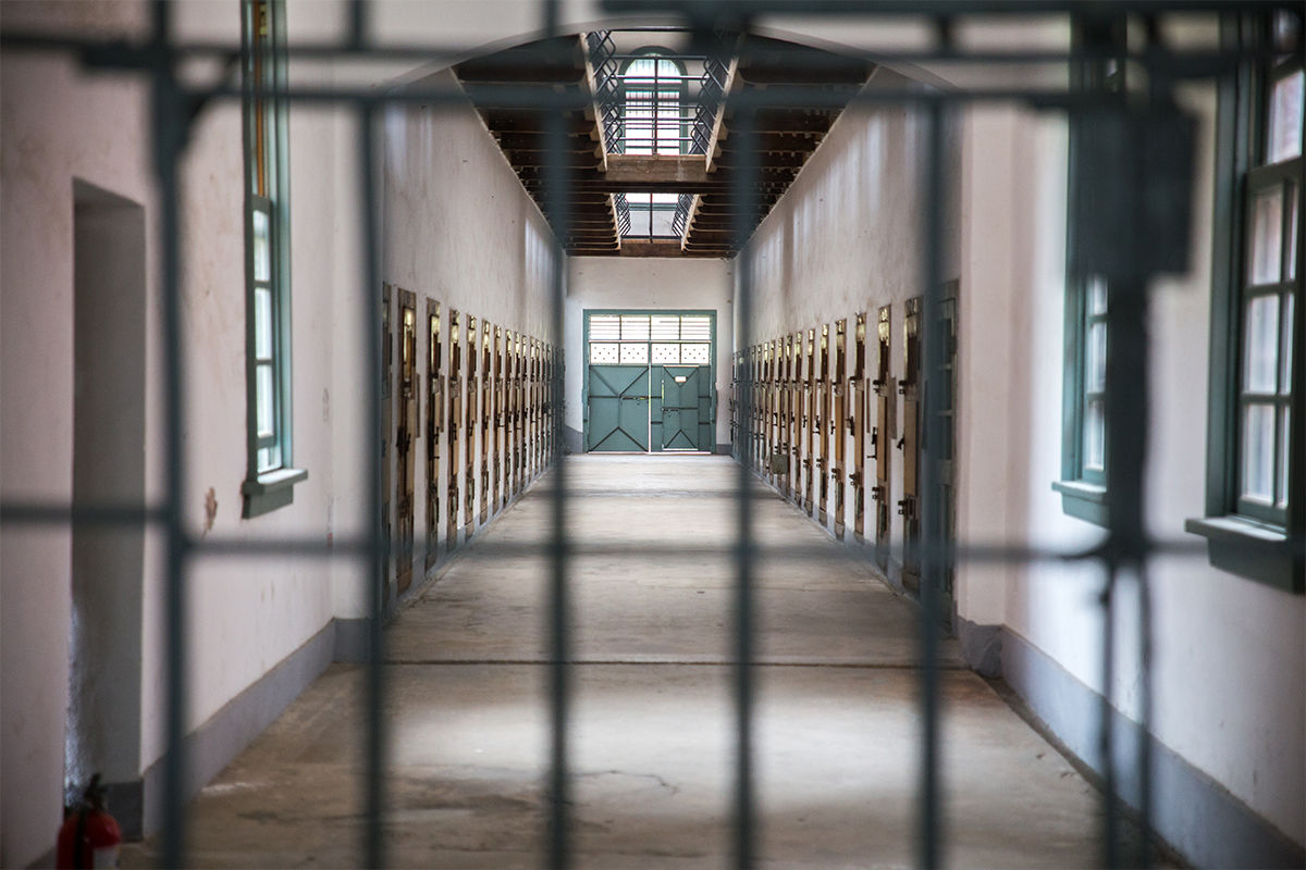 Behind prison bars in a long corridor in Korea
