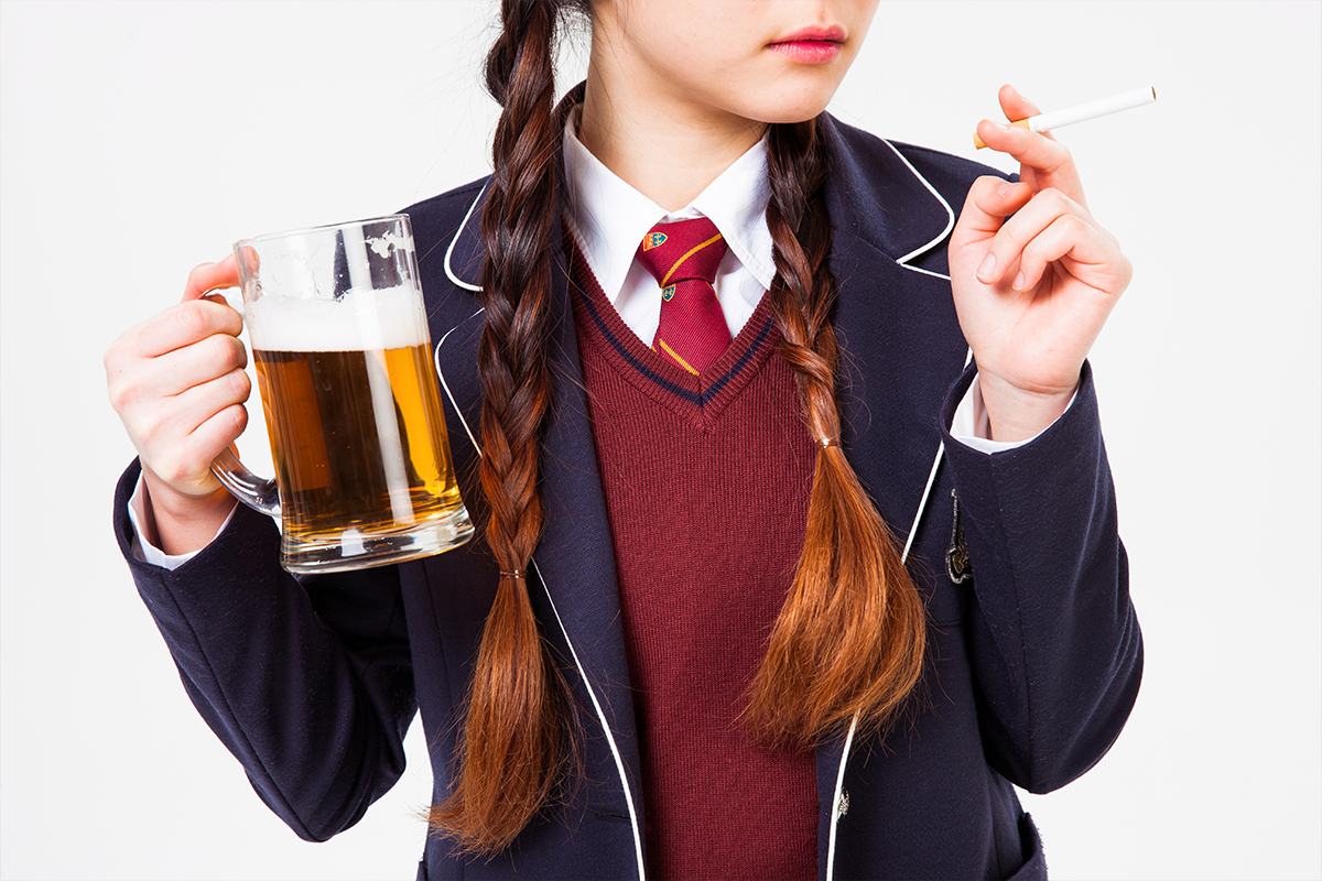 Korean girl in school uniform drinking and smoking