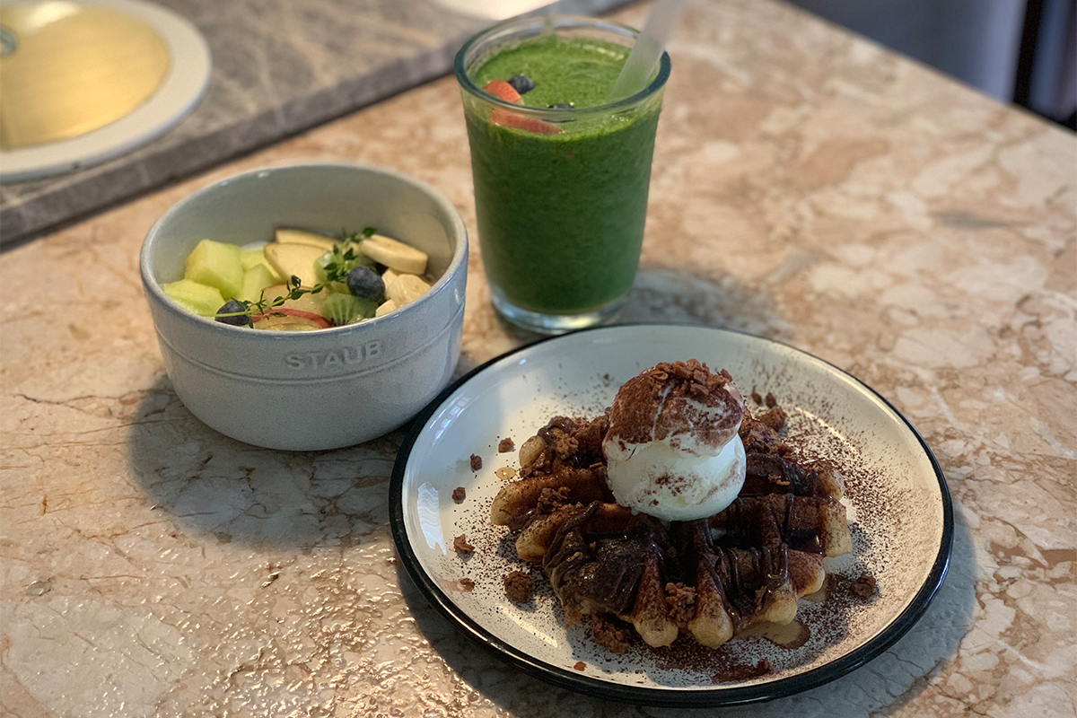 drink, yogurt, and Nutella waffle on the table at Modern Table