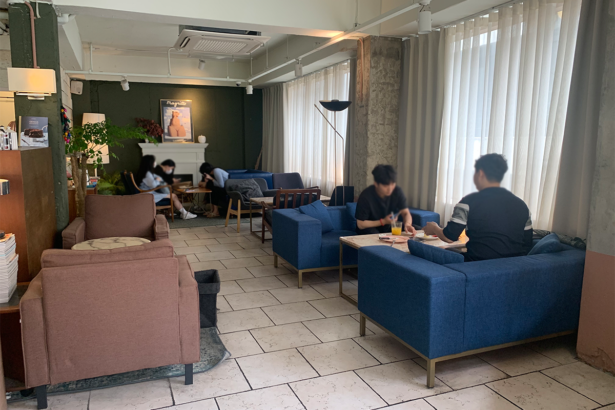 brown seats on the left and blue seats on the right at Modern Table interior