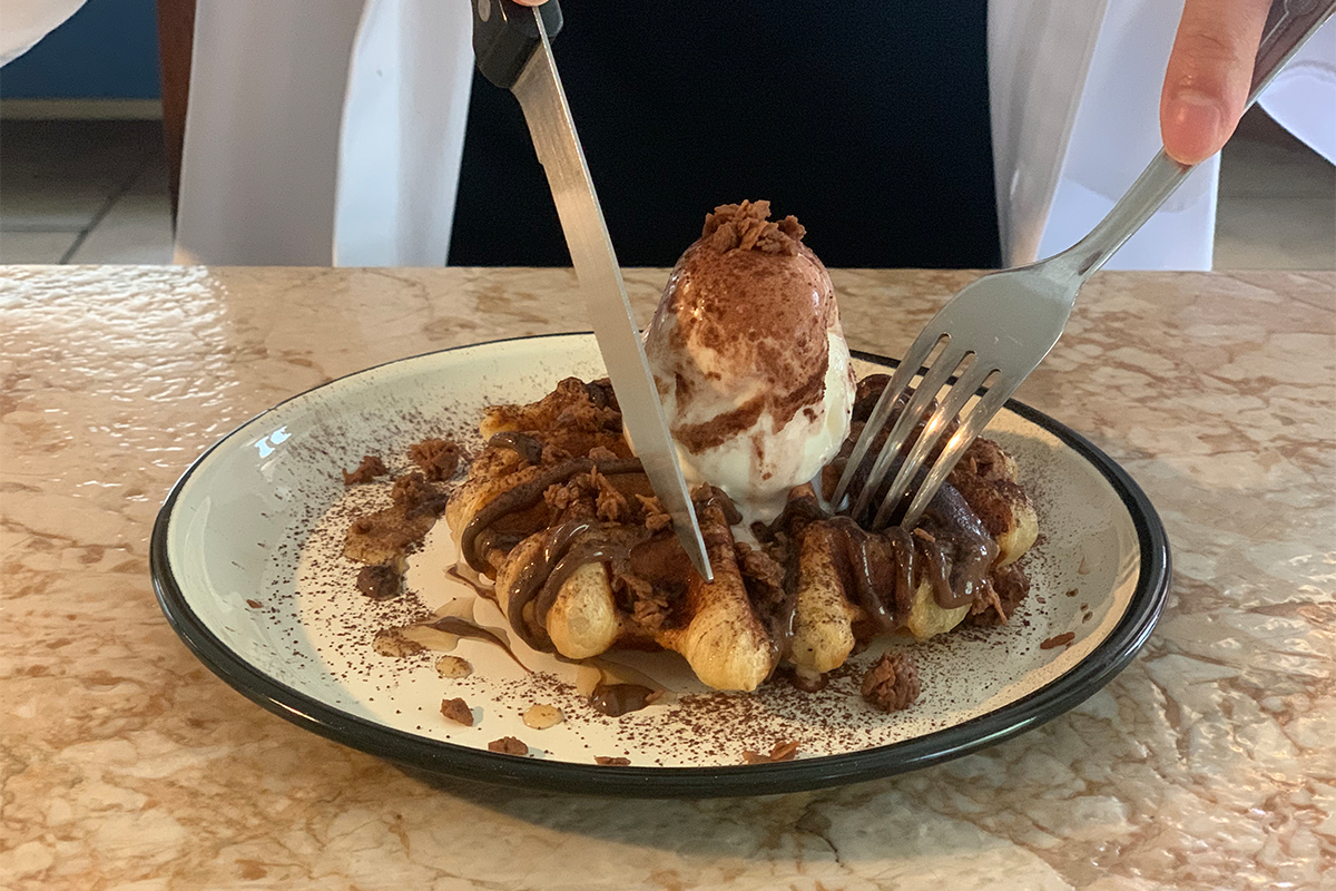 putting a fork into Nutella waffles at Modern Table