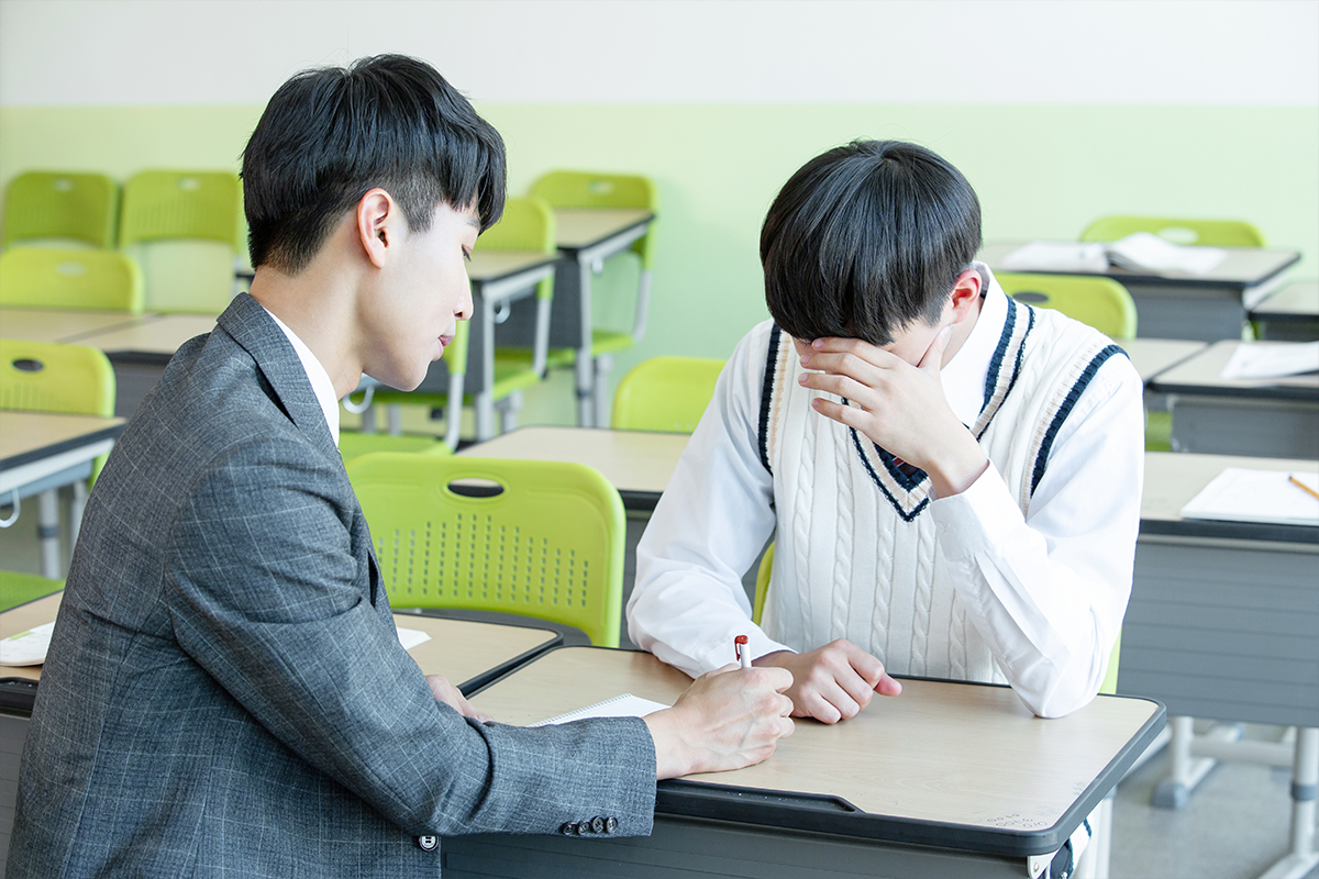 Korean student being scolded for his behaviour