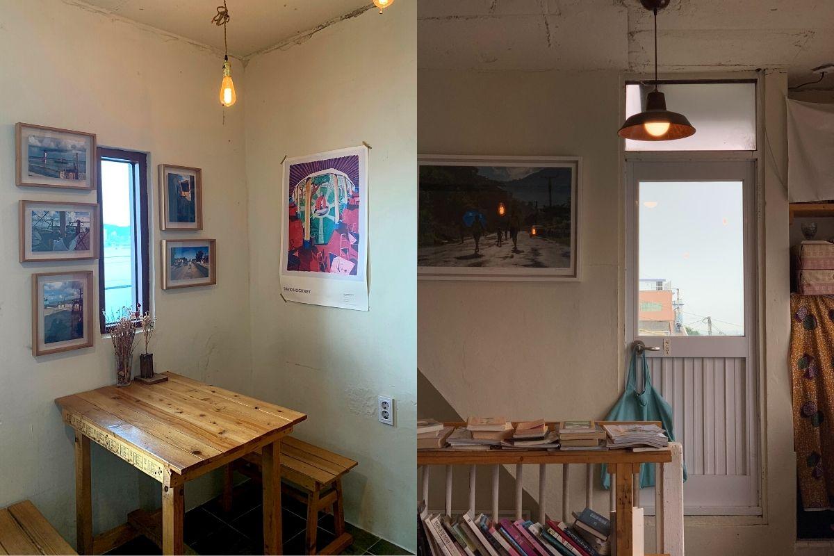 interior, wooden tables and chairs, books, shelves, paintings, inside Sonmokseoga cafe, Huinnyeoul Culture Village, Busan, Korea
