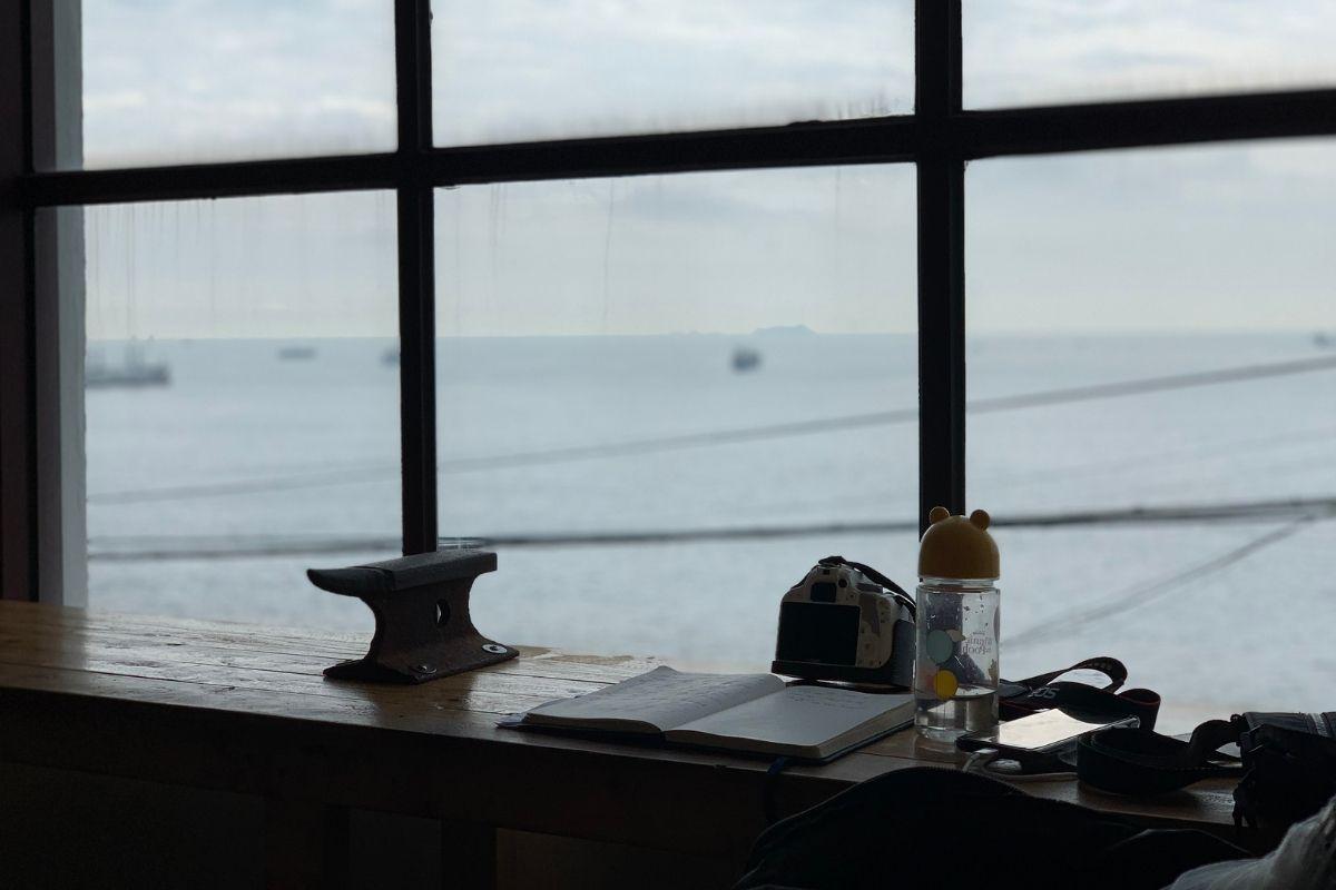 aesthetic window ocean view, journal, camera, Sonmokseoga cafe, Huinnyeoul Culture Village, Busan, Korea