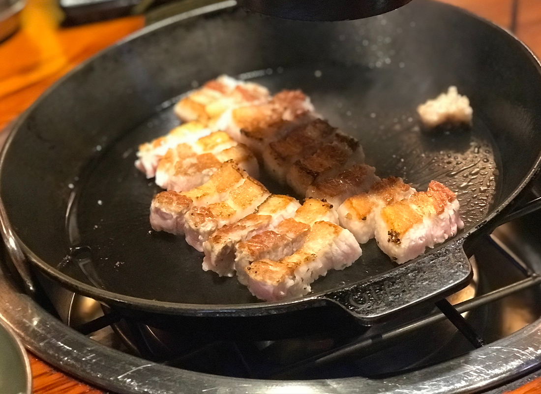 Pork belly ready to eat after being fully cooked on the grill