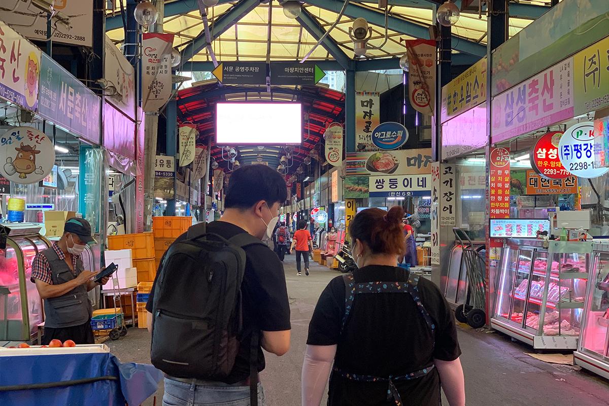 Customers walking in meat market in Seoul