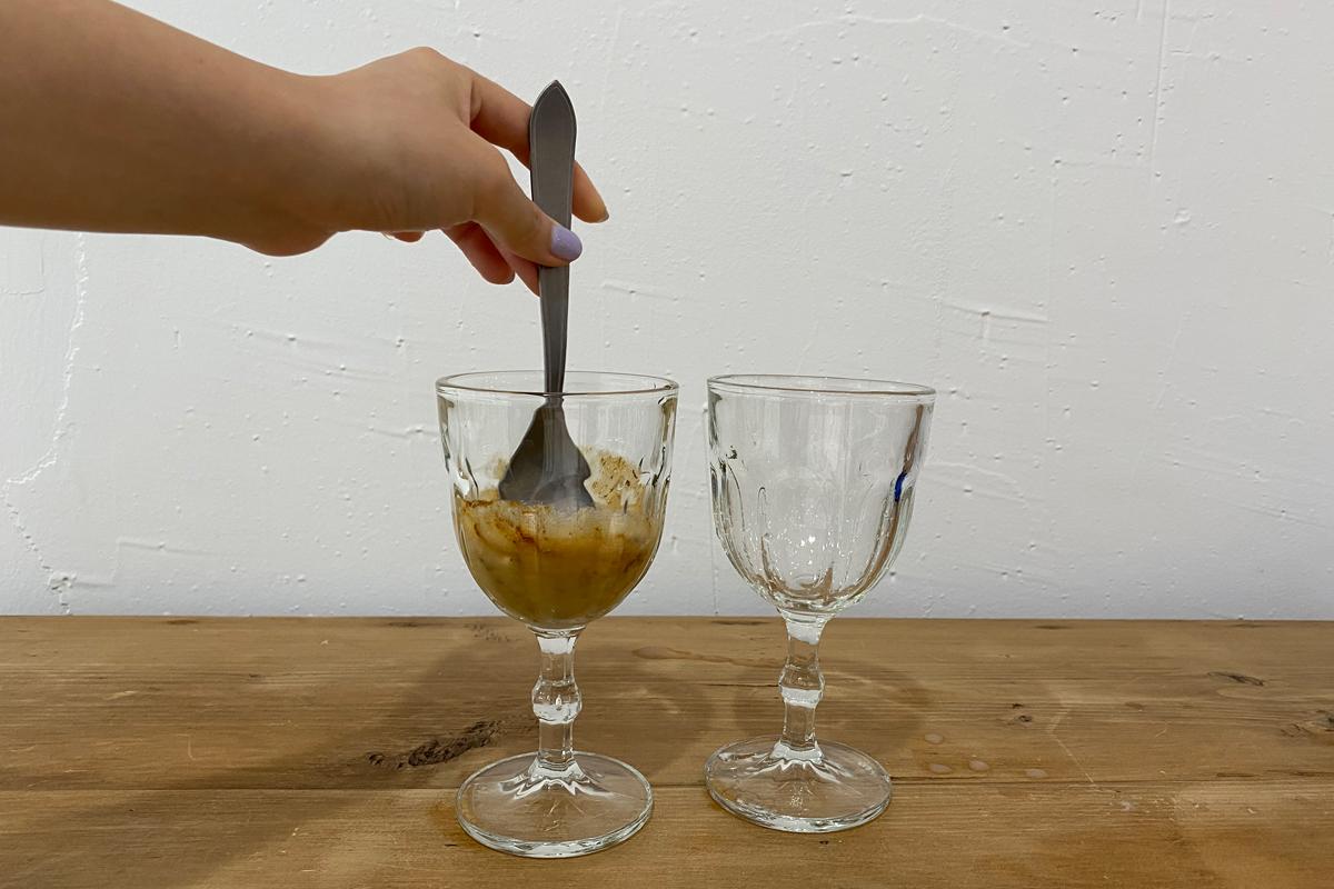Using spoon to mix coffee mix and makegolli together