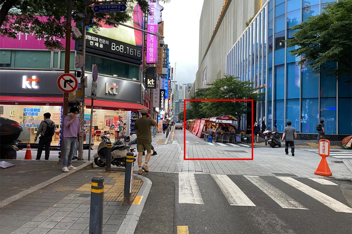 Busan Korea Seomyeon Pojangmacha Street, city buildings, people walking