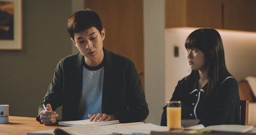 scene from Parasite, university student tutoring high school student
