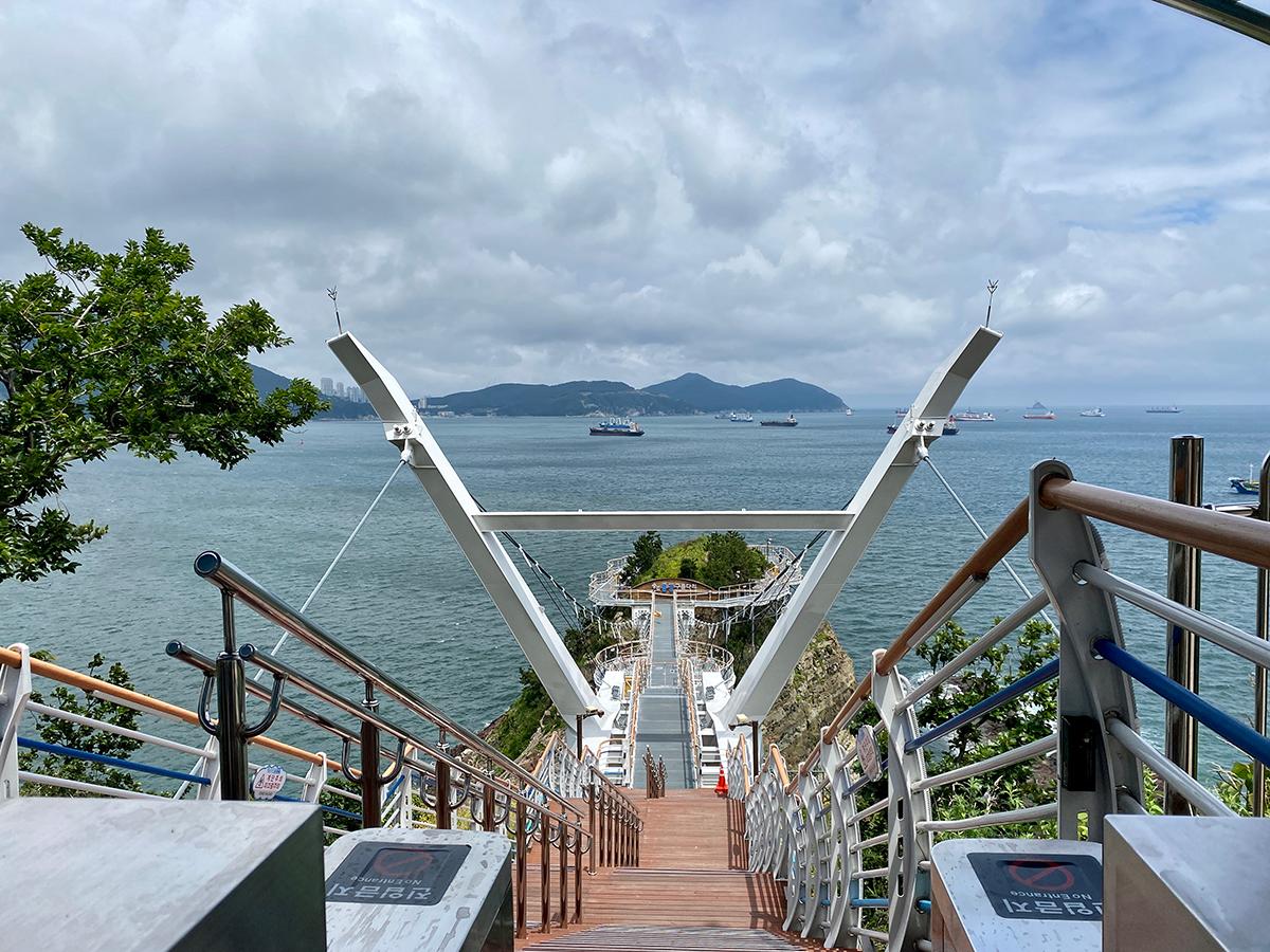 Songdo Yonggung Suspension Bridge looking down towards the shoreline