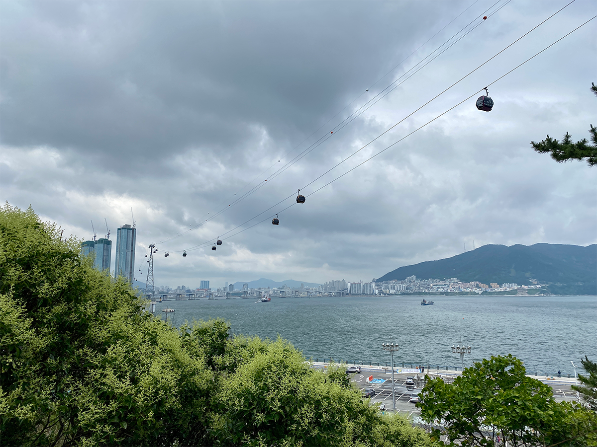 Songdo Beach with lines of cable cars running above