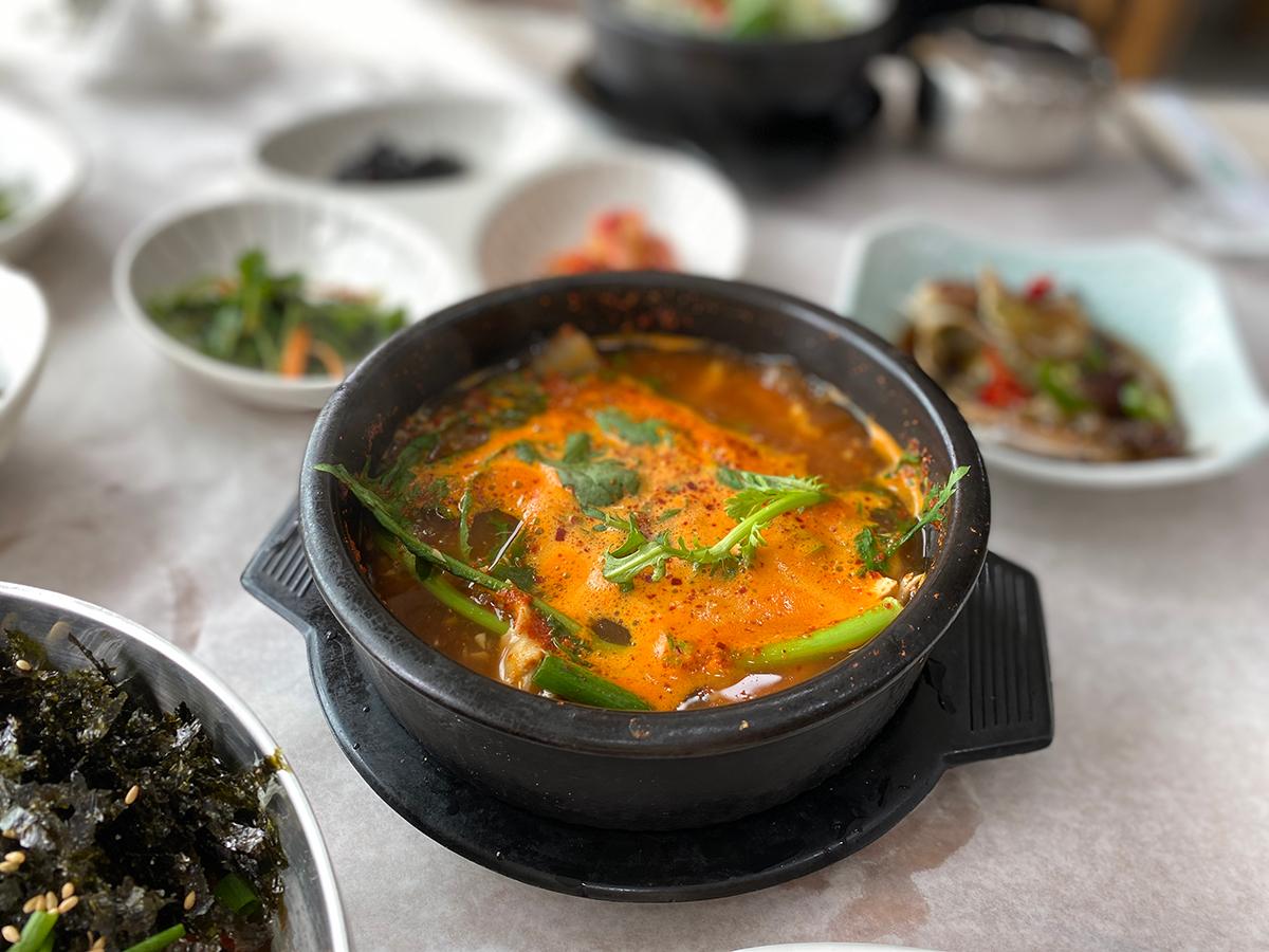 Maeuntang, or boiling fish soup served in a black pot in Busan