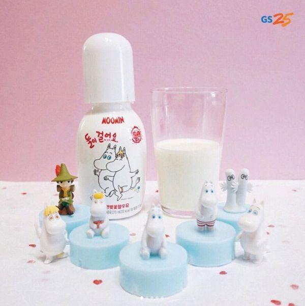 A Korean GS25 exclusive: gathering of Moomin characters on bottle caps around a glass of milk