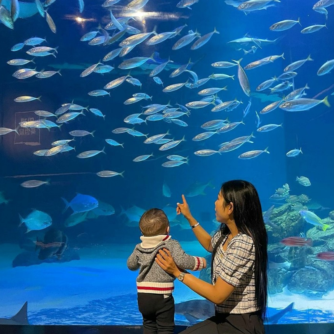 Baby and mom at aquarium