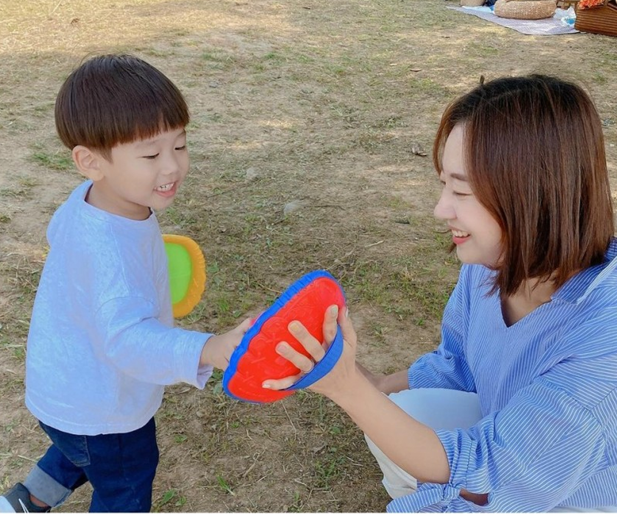 Boy and mom playing outside