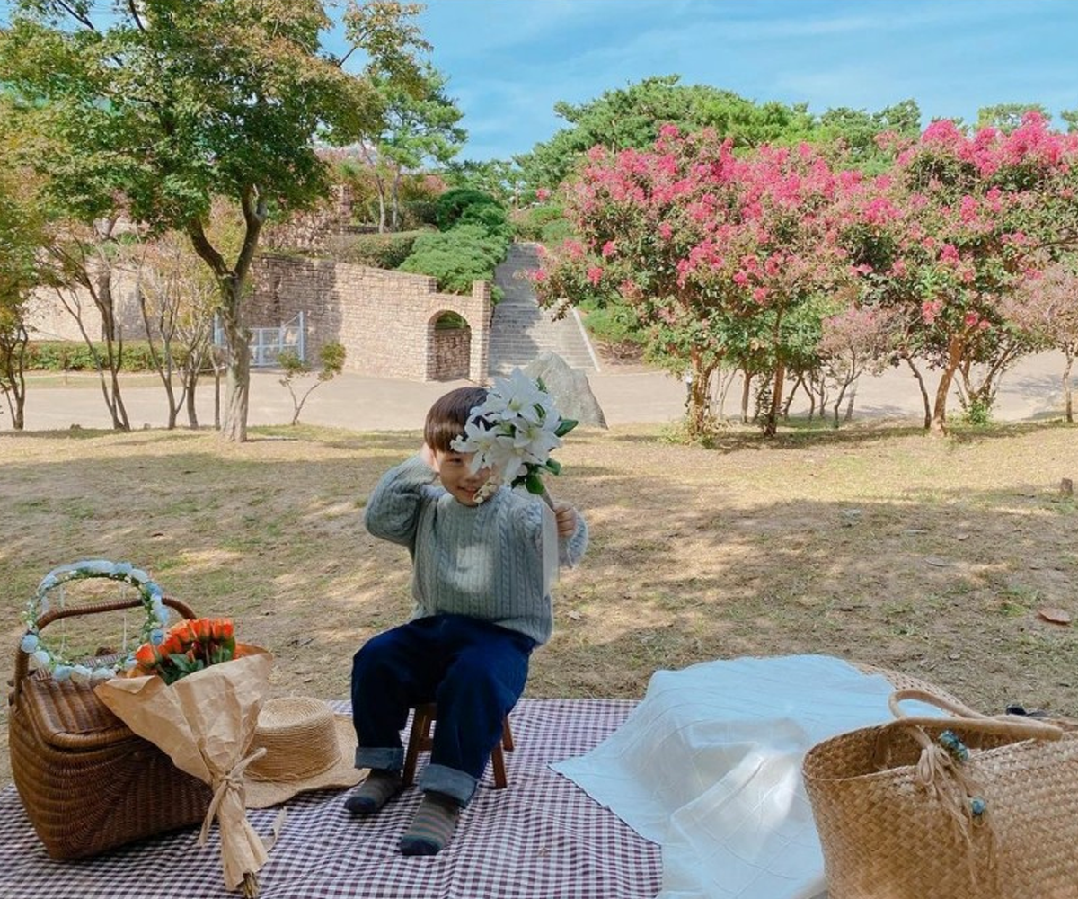 Kid on picnic blanket