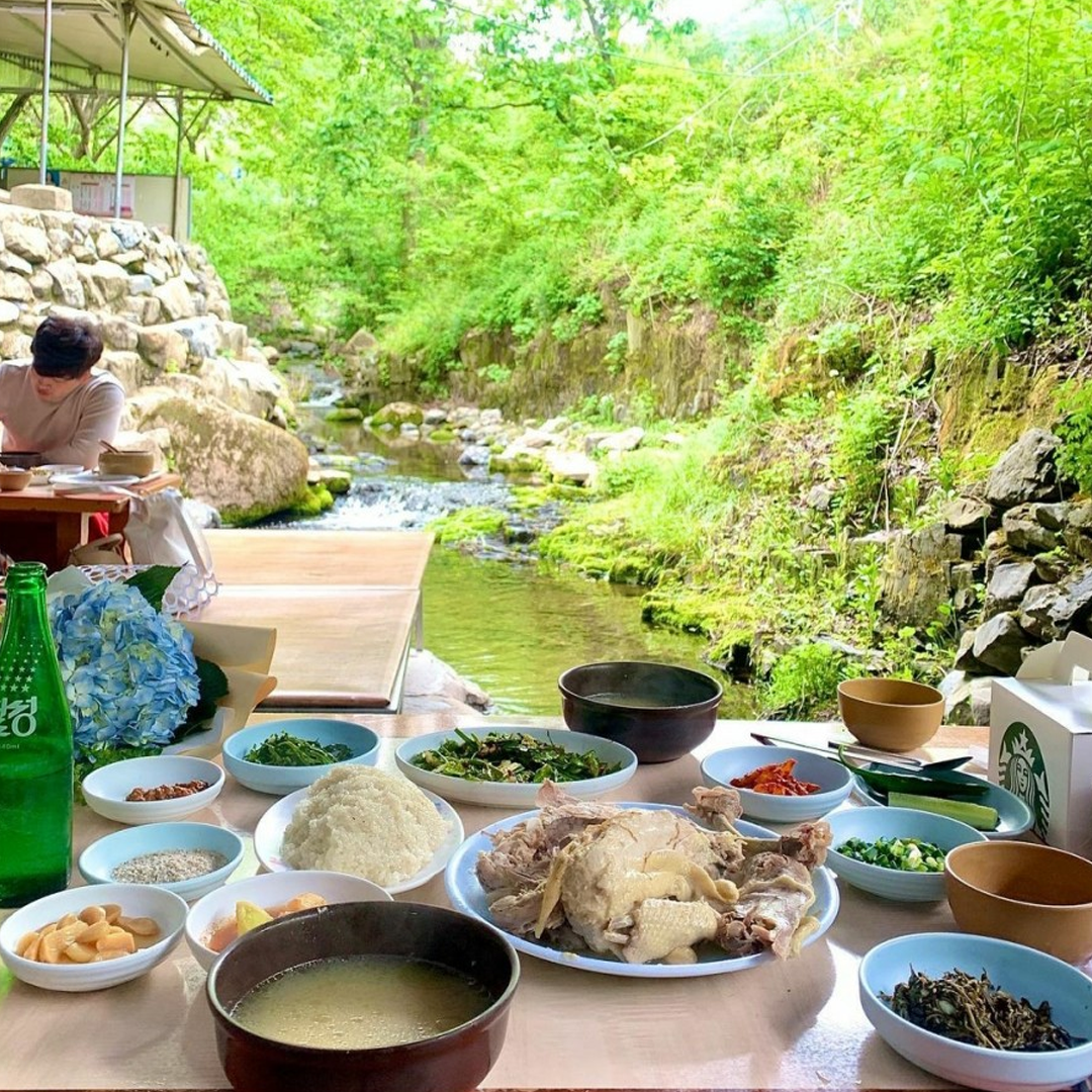 Table of food by a stream in the valley
