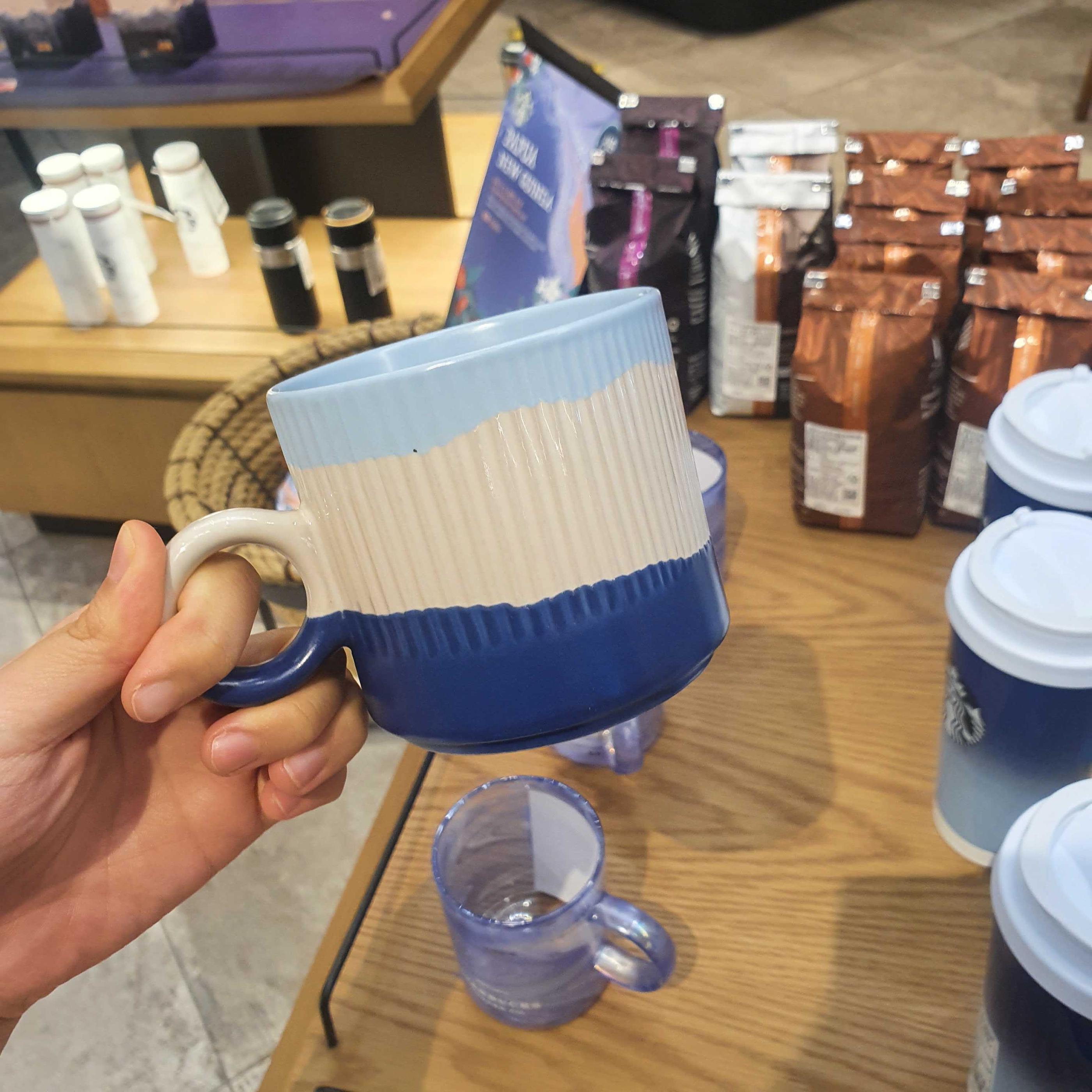 Light blue, cream, and dark blue ceramic mug available for sale at Starbucks Korea