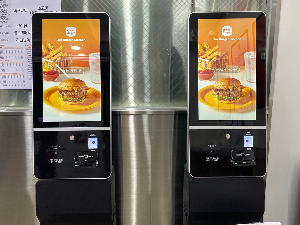 two self-order kiosks at ISAAC Burger in Korea